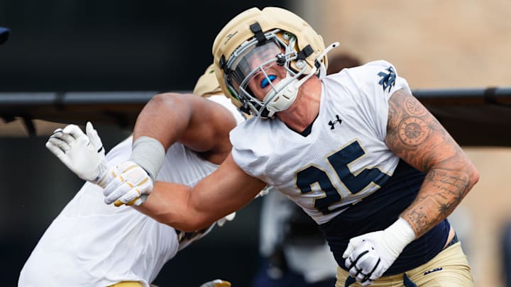 Notre Dame defensive ends Preston Zinter, right, and Christopher Burgess Jr. run a drill during a football practice at Irish Athletic Center on Thursday, July 31, 2025, in South Bend.