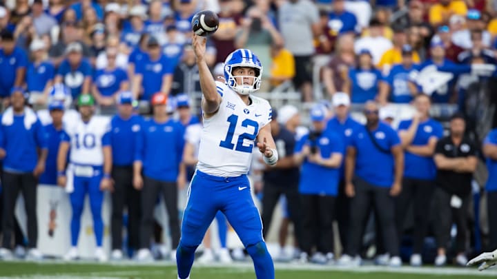 Nov 23, 2024; Tempe, Arizona, USA; Brigham Young Cougars quarterback Jake Retzlaff (12) against the Arizona State Sun Devils in the second half at Mountain America Stadium. Mandatory Credit: Mark J. Rebilas-Imagn Images