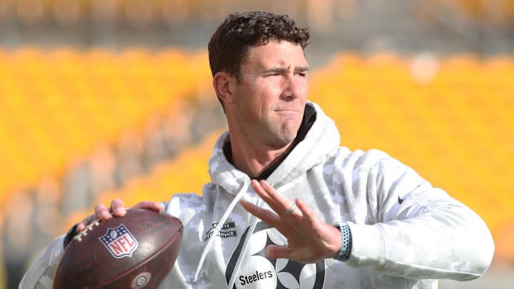 Nov 17, 2024; Pittsburgh, Pennsylvania, USA;  Pittsburgh Steelers quarterbacks coach Tom Arth tosses a football on the field before the game against the Baltimore Ravens at Acrisure Stadium. Mandatory Credit: Charles LeClaire-Imagn Images