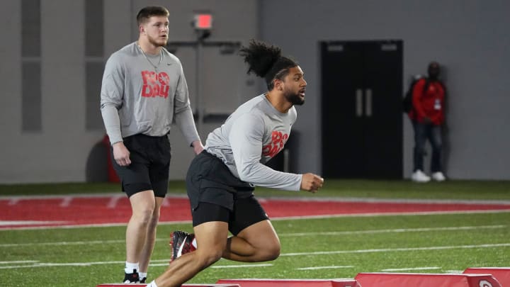 Mar 20, 2024; Columbus, Ohio, USA; Ohio State Buckeyes defensive ends JT Tuimoloau (44) and Jack Sawyer (33) work out during Pro Day at the Woody Hayes Athletic Center. Mar 20, 2024; Columbus, Ohio, USA; Ohio State Buckeyes defensive ends JT Tuimoloau (44) and Jack Sawyer (33) work out during Pro Day at the Woody Hayes Athletic Center.