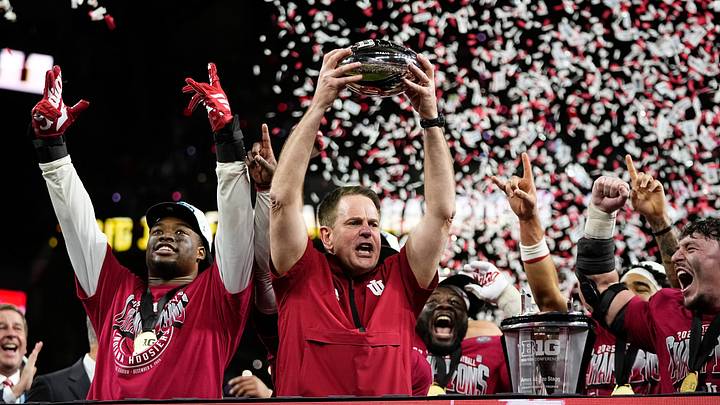 Indiana Hoosiers head coach Curt Cignetti hoists the trophy after winning the Big Ten Conference championship game against the Ohio State Buckeyes at Lucas Oil Stadium in Indianapolis on Dec. 6, 2025. Ohio State lost 13-10. Indiana Hoosiers head coach Curt Cignetti hoists the trophy after winning the Big Ten Conference championship game against the Ohio State Buckeyes at Lucas Oil Stadium in Indianapolis on Dec. 6, 2025. Ohio State lost 13-10.
