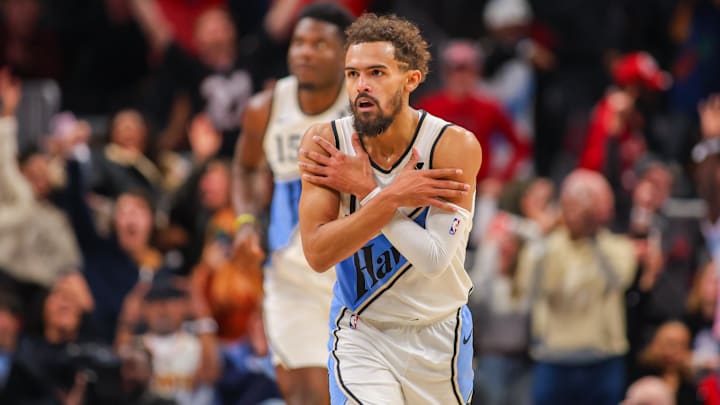 Dec 26, 2024; Atlanta, Georgia, USA; Atlanta Hawks guard Trae Young (11) shows emotion after a three-pointer against the Chicago Bulls in the fourth quarter at State Farm Arena. Mandatory Credit: Brett Davis-Imagn Images