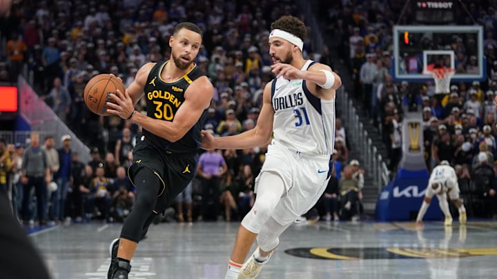 Golden State Warriors guard Stephen Curry (30) drives past Dallas Mavericks guard Klay Thompson (31) in the fourth quarter at the Chase Center. Mandatory Credit: Cary Edmondson-Imagn Images