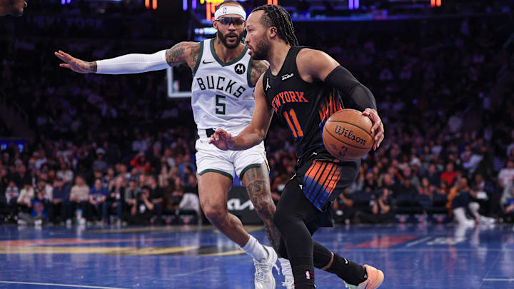Nov 28, 2025; New York, New York, USA; New York Knicks guard Jalen Brunson (11) dribbles as Milwaukee Bucks guard Gary Trent Jr. (5) defends during the second half at Madison Square Garden. Mandatory Credit: Vincent Carchietta-Imagn Images