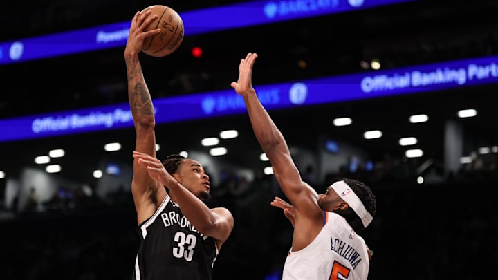Apr 13, 2025; Brooklyn, New York, USA; Brooklyn Nets center Nic Claxton (33) goes to the basket after the game New York Knicks forward Precious Achiuwa (5) during the second half at Barclays Center. Mandatory Credit: Vincent Carchietta-Imagn Images Apr 13, 2025; Brooklyn, New York, USA; Brooklyn Nets center Nic Claxton (33) goes to the basket after the game New York Knicks forward Precious Achiuwa (5) during the second half at Barclays Center. Mandatory Credit: Vincent Carchietta-Imagn Images