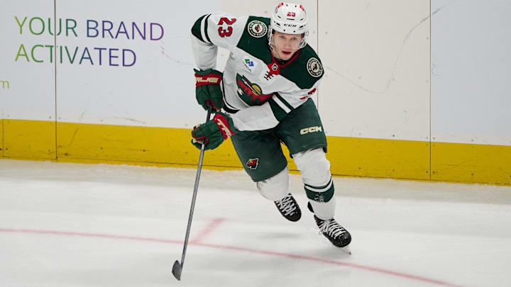 Jan 11, 2025; San Jose, California, USA; Minnesota Wild center Marco Rossi (23) plays the puck against the San Jose Sharks during the third period at SAP Center at San Jose. Mandatory Credit: Robert Edwards-Imagn Images