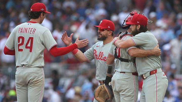 Sep 30, 2026; Cumberland, Georgia, USA; Philadelphia Phillies pitcher Andrew Painter (24), designated hitter Kyle Schwarber (12), catcher J.T. Realmuto (10) and outfielder Brandon Marsh (16) celebrate after a win against the Atlanta Braves in game two of the Wildcard round for the 2026 MLB Playoffs at Truist Park. Mandatory Credit: Brett Davis-Imagn Images Sep 30, 2026; Cumberland, Georgia, USA; Philadelphia Phillies pitcher Andrew Painter (24), designated hitter Kyle Schwarber (12), catcher J.T. Realmuto (10) and outfielder Brandon Marsh (16) celebrate after a win against the Atlanta Braves in game two of the Wildcard round for the 2026 MLB Playoffs at Truist Park. Mandatory Credit: Brett Davis-Imagn Images