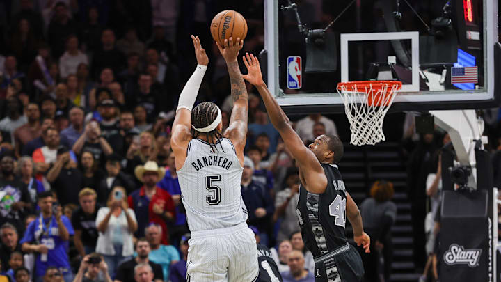 Orlando Magic forward Paolo Banchero (5) shoots a game-winning basket against San Antonio Spurs forward Harrison Barnes (40) during the 4th quarter at Kia Center.
