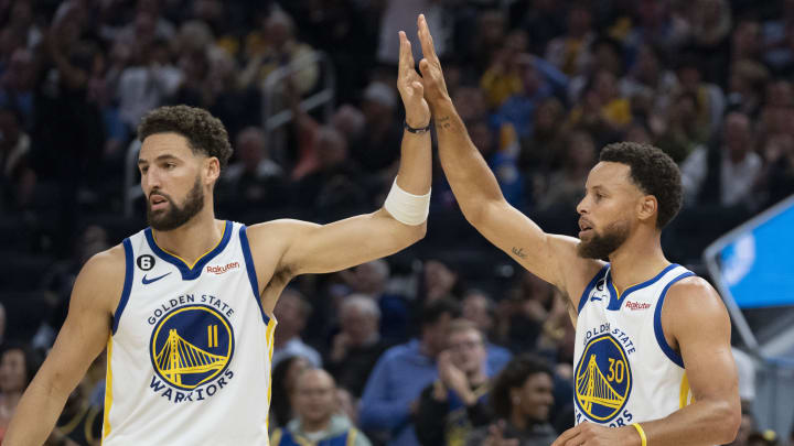 October 18, 2022; San Francisco, California, USA; Golden State Warriors guard Klay Thompson (11) high-fives guard Stephen Curry (30) against the Los Angeles Lakers during the second quarter at Chase Center. Mandatory Credit: Kyle Terada-USA TODAY Sports
