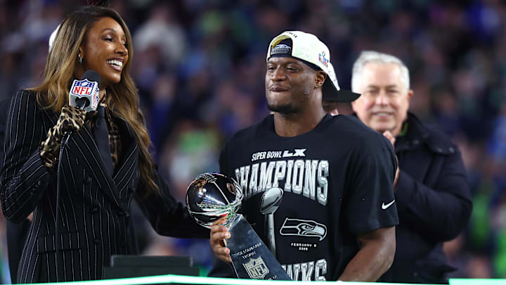 Feb 8, 2026; Santa Clara, CA, USA; Seattle Seahawks running back Kenneth Walker III (9) celebrates with the Vince Lombardi trophy after defeating the New England Patriots in Super Bowl LX at Levi's Stadium. Mandatory Credit: Mark J. Rebilas-Imagn Images