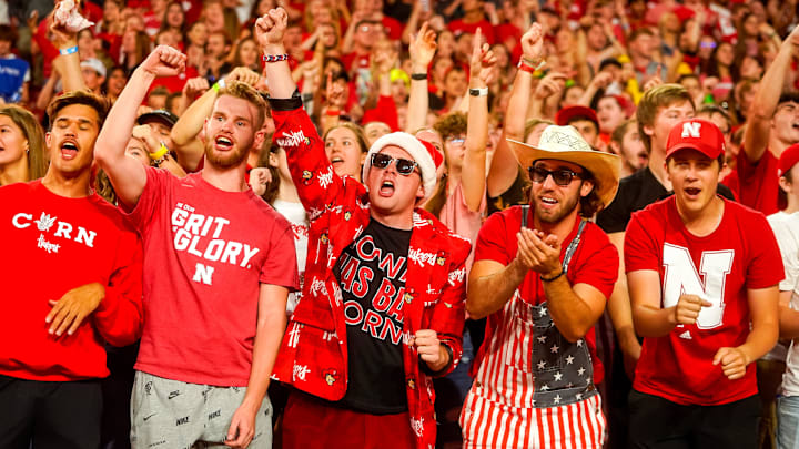 Oct 1, 2022; Lincoln, Nebraska, USA; Nebraska Cornhuskers fans cheer during a break between quarters against the Indiana Hoosiers at Memorial Stadium. Mandatory 