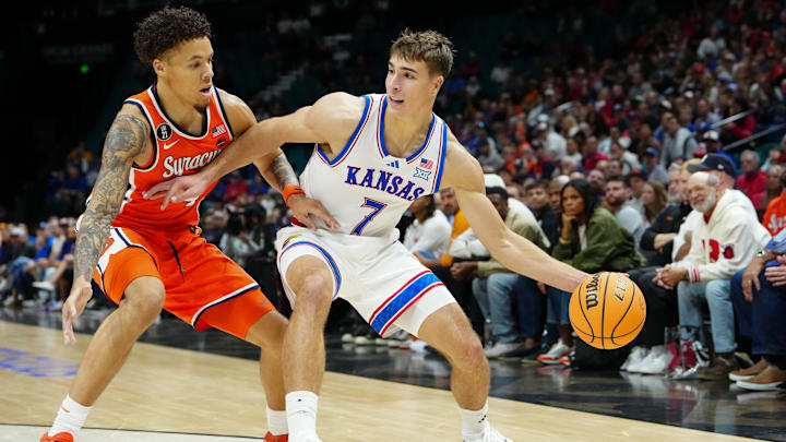 Nov 25, 2025; Las Vegas, Nevada, USA; Syracuse Orange guard Nate Kingz (4) defends against Kansas Jayhawks guard Kohl Rosario (7) during the first half in a 2025 Players Era Festival group play game at MGM Grand Garden Arena. Mandatory Credit: Stephen R. Sylvanie-Imagn Images