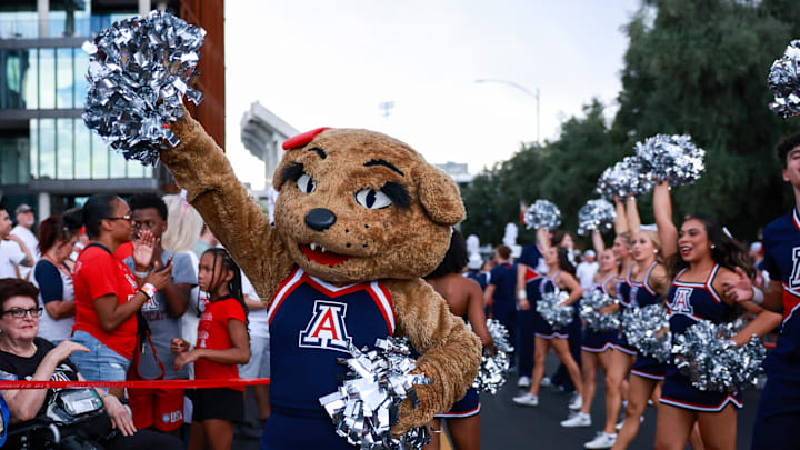 Aug 31, 2024; Tucson, Arizona, USA; Arizona Wildcats mascot Wilma walks along side Arizona Wildcats cheerleaders through the Wildcat Walk before the game at Arizona Stadium. Mandatory Credit: Aryanna Frank-Imagn Images