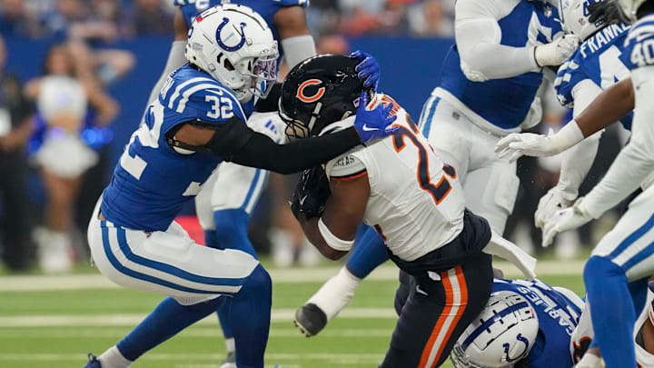Former Colts safety Julian Blackmon works to bring down  Bears running back Roschon Johnson last season.