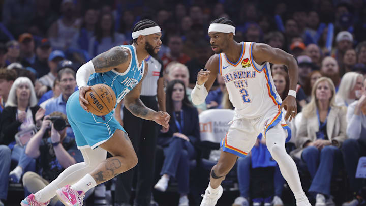 Jan 5, 2026; Oklahoma City, Oklahoma, USACharlotte Hornets forward Miles Bridges (0) drives to the basket against Oklahoma City Thunder guard Shai Gilgeous-Alexander (2) during the first quarter at Paycom Center. Mandatory Credit: Alonzo Adams-Imagn Images
