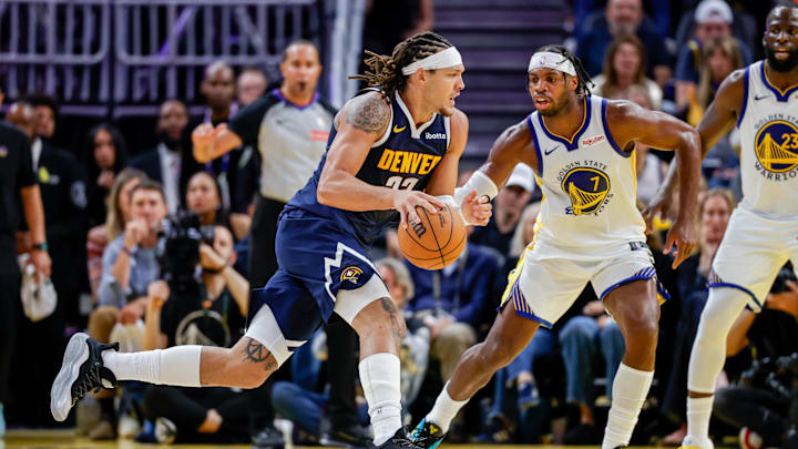 Oct 23, 2025; San Francisco, California, USA; Denver Nuggets forward Aaron Gordon (32) drives on Golden State Warriors guard Buddy Hield (7) during the fourth quarter at Chase Center. Mandatory Credit: Bob Kupbens-Imagn Images Oct 23, 2025; San Francisco, California, USA; Denver Nuggets forward Aaron Gordon (32) drives on Golden State Warriors guard Buddy Hield (7) during the fourth quarter at Chase Center. Mandatory Credit: Bob Kupbens-Imagn Images