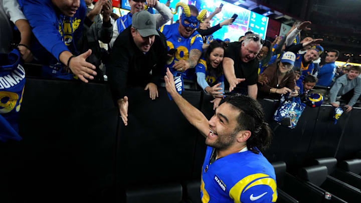 Los Angeles Rams receiver Puka Nacua (17) high-fives fans after their 27-9 playoff win over the Minnesota Vikings at State Farm Stadium on Jan. 13, 2025, in Glendale. Los Angeles Rams receiver Puka Nacua (17) high-fives fans after their 27-9 playoff win over the Minnesota Vikings at State Farm Stadium on Jan. 13, 2025, in Glendale.
