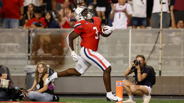 Sep 7, 2024; Tucson, Arizona, USA; Arizona Wildcats running back Kedrick Reescano (3) runs to the end zone to make a touch down against Northern Arizona Lumberjacks during the fourth quarter at Arizona Stadium. Mandatory Credit: Aryanna Frank-Imagn Images Sep 7, 2024; Tucson, Arizona, USA; Arizona Wildcats running back Kedrick Reescano (3) runs to the end zone to make a touch down against Northern Arizona Lumberjacks during the fourth quarter at Arizona Stadium. Mandatory Credit: Aryanna Frank-Imagn Images