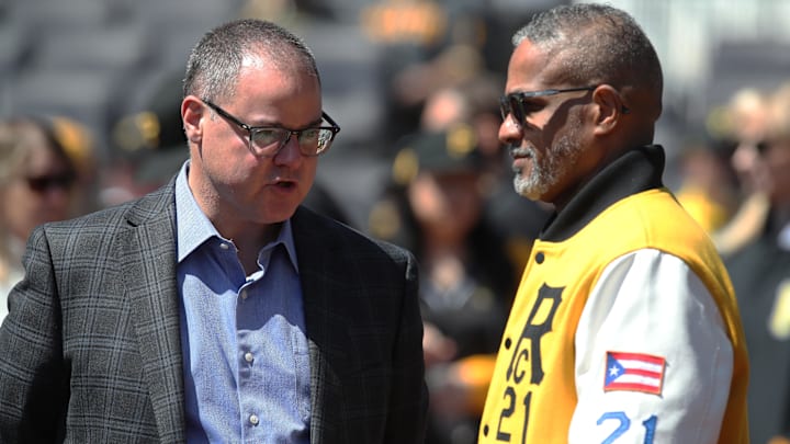 Apr 17, 2025; Pittsburgh, Pennsylvania, USA;  Pittsburgh Pirates president Travis Williams (left) and Roberto Clemente Jr. (right) son of former Pirates right fielder Roberto Clemente (not pictured) talk on the field before the game against the Washington Nationals at PNC Park. Mandatory Credit: Charles LeClaire-Imagn Images