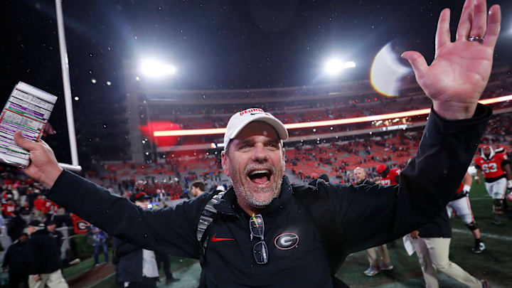 Georgia Offensive Coordinator Mike Bobo celebrates after wining a NCAA college football game against Ole Miss in Athens, Ga., on Saturday, Nov. 11, 2023. Georgia won 52-17.