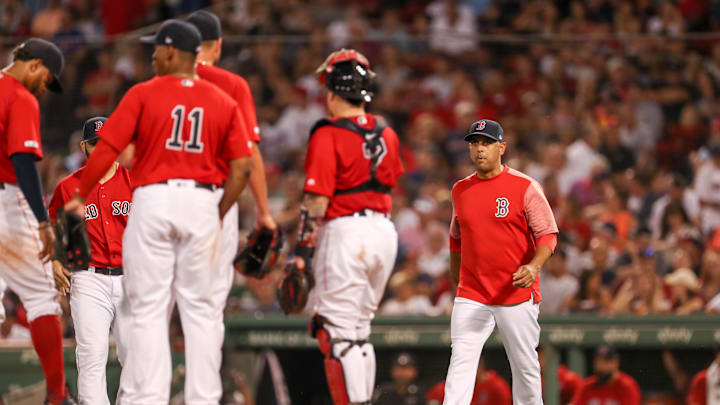 Aug 20, 2019; Boston, MA, USA; Boston Red Sox Manager Alex Cora (20) walks to the mound to make a pitching change during the third inning against the Philadelphia Phillies at Fenway Park. Mandatory Credit: Paul Rutherford-Imagn Images