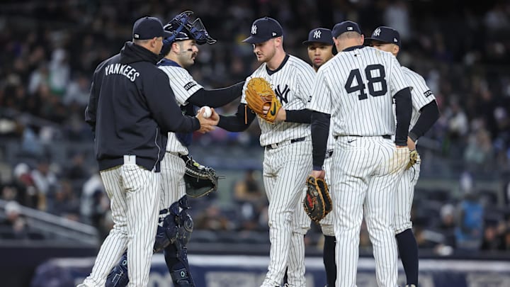Apr 16, 2025; Bronx, New York, USA;  New York Yankees starting pitcher Clarke Schmidt (36) is taken out of the game by manager Aaron Boone (17) in the sixth inning against the Kansas City Royals at Yankee Stadium. Mandatory Credit: Wendell Cruz-Imagn Images