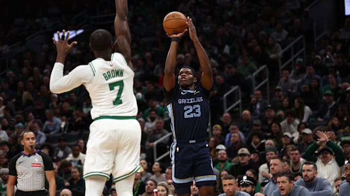 Nov 12, 2025; Boston, Massachusetts, USA; Memphis Grizzlies forward Cedric Coward (23) shoots against Boston Celtics guard Jaylen Brown (7) during the second quarter at TD Garden. Mandatory Credit: Winslow Townson-Imagn Images