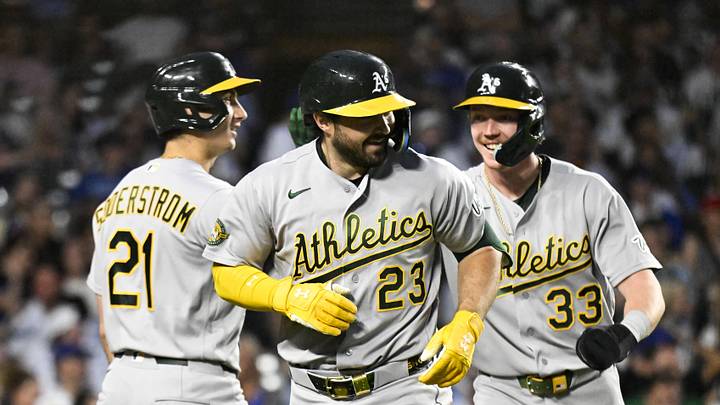 Jun 4, 2026; Chicago, Illinois, USA; Oakland Athletics catcher Shea Langeliers (23) celebrates with left fielder Tyler Soderstrom (21) and center fielder Henry Bolte (33) after hitting a two run inside the park home run against the Chicago Cubs during the sixth inning at Wrigley Field. Mandatory Credit: Matt Marton-Imagn Images Jun 4, 2026; Chicago, Illinois, USA; Oakland Athletics catcher Shea Langeliers (23) celebrates with left fielder Tyler Soderstrom (21) and center fielder Henry Bolte (33) after hitting a two run inside the park home run against the Chicago Cubs during the sixth inning at Wrigley Field. Mandatory Credit: Matt Marton-Imagn Images