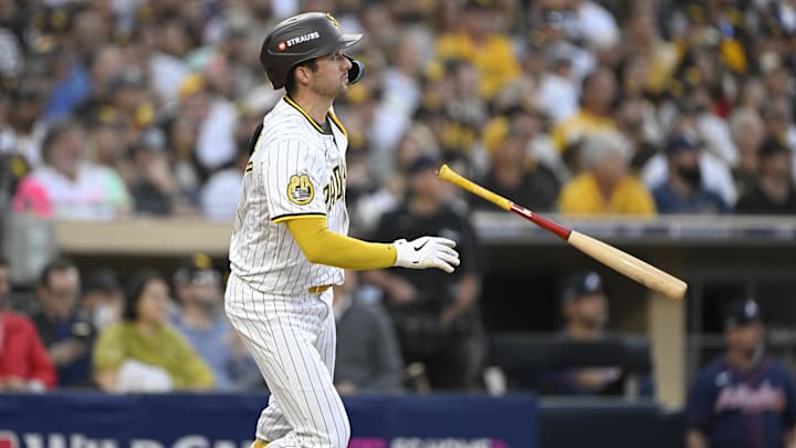 Oct 2, 2024; San Diego, California, USA; San Diego Padres catcher Kyle Higashioka (20) hits a solo home run during the second inning of game two in the Wildcard round for the 2024 MLB Playoffs against the Atlanta Braves at Petco Park. Mandatory Credit: Denis Poroy-Imagn Images