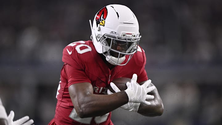 Nov 3, 2025; Arlington, Texas, USA; Arizona Cardinals running back Bam Knight (20) runs against the Dallas Cowboys in the first half at AT&T Stadium. Mandatory Credit: Jerome Miron-Imagn Images