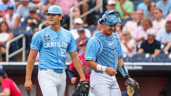 North Carolina Tar Heels starting pitcher Jason DeCaro (29) and catcher Colin Hynek (23) walk off the field during the first inning against the Mississippi Rebels at Charles Schwab Field. North Carolina Tar Heels starting pitcher Jason DeCaro (29) and catcher Colin Hynek (23) walk off the field during the first inning against the Mississippi Rebels at Charles Schwab Field.