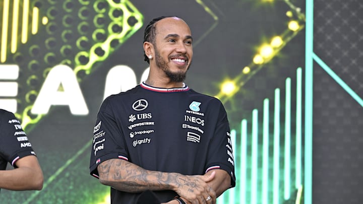 Oct 19, 2024; Austin, Texas, USA; Mercedes AMG Petronas F1 Team driver Lewis Hamilton (44) of Team Great Britain smiles to the crowd during a fan forum before the Sprint Race in the 2024 Formula One US Grand Prix at Circuit of the Americas. Mandatory Credit: Jerome Miron-Imagn Images