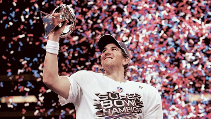 Super Bowl XLVI --   New York Giants vs New England --  Eli Manning after being named MVP and holding the Lombardi Trophy.

Super Bowl Xlvi New York Giants Vs New England In The First Half