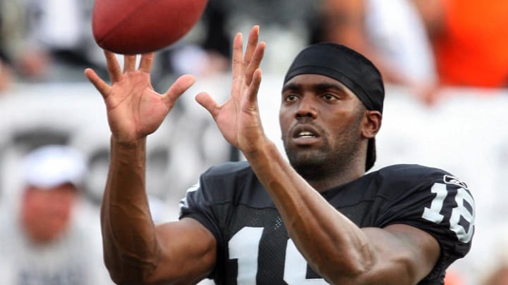 Aug 6, 2006; Canton, OH, USA;  Oakland Raiders receiver (18) Randy Moss before kickoff against Philadelphia Eagles during the Pro Football Hall of Fame Game at Fawcett Stadium. Mandatory Credit: Tony Tomsic-USA TODAY NETWORK