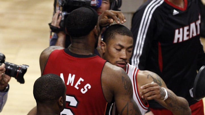 May 26, 2011; Chicago, IL, USA; Miami Heat guard Dwyane Wade (3) watches as forward LeBron James (6) hugs Chicago Bulls guard Derrick Rose (right) after game five of the eastern conference finals of the 2011 NBA playoffs at the United Center. The Heat won 83-80. Mandatory Credit: Jerry Lai-Imagn Images May 26, 2011; Chicago, IL, USA; Miami Heat guard Dwyane Wade (3) watches as forward LeBron James (6) hugs Chicago Bulls guard Derrick Rose (right) after game five of the eastern conference finals of the 2011 NBA playoffs at the United Center. The Heat won 83-80. Mandatory Credit: Jerry Lai-Imagn Images