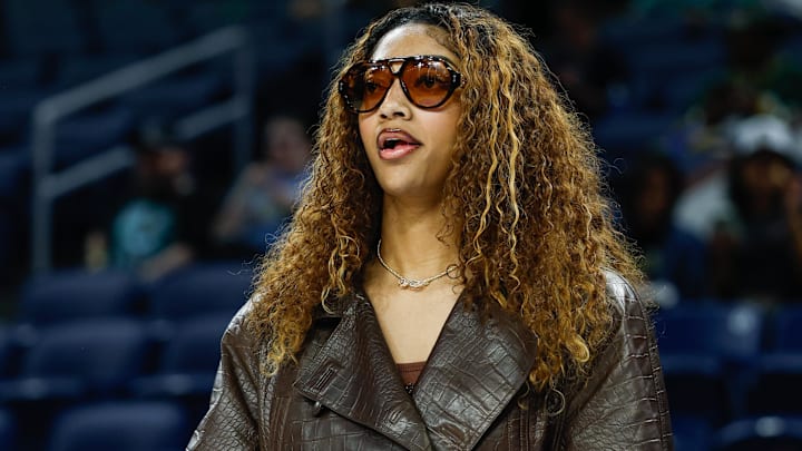 Sep 11, 2025; Chicago, Illinois, USA; Injured Chicago Sky forward Angel Reese (5) stands on the sidelines before a WNBA game against the New York Liberty at Wintrust Arena.