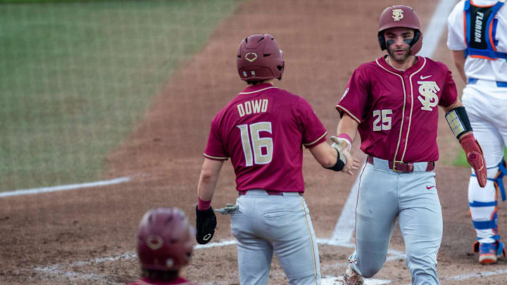 Florida State outfielder Brayden Dowd (16) and Florida State catcher Hunter Carns (25) score for Florida State against Florida, March 10, 2026, at Condron Family Ballpark in Gainesville, Florida. [Cyndi Chambers/ Gainesville Sun] 2026