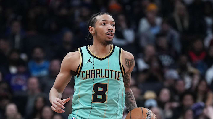 Apr 9, 2025; Toronto, Ontario, CAN; Charlotte Hornets guard Nick Smith Jr. (8) dribbles the ball up court against the Toronto Raptors during the fourth quarter at Scotiabank Arena. Mandatory Credit: Nick Turchiaro-Imagn Images