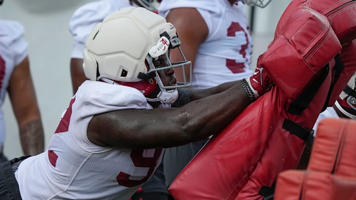 July 30, 2025; Tuscaloosa, AL, USA; defensive lineman Jeremiah Beaman hits the sled during the first practice session of the preseason for the Alabama Crimson Tide.