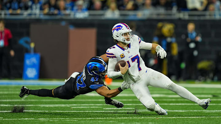 Buffalo Bills quarterback Josh Allen (17) slides after getting the first down during the second half at Ford Field in Detroit on Sunday, Dec. 15, 2024.