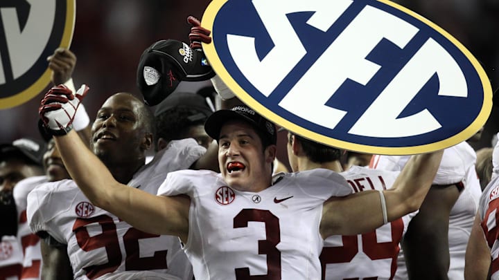 Dec 1, 2012; Atlanta, GA, USA; Alabama Crimson Tide defensive back Vinnie Sunseri (3) holds up the SEC sign after winning the 2012 SEC Championship game against the Georgia Bulldogs at the Georgia Dome.  Alabama won 32-28. 