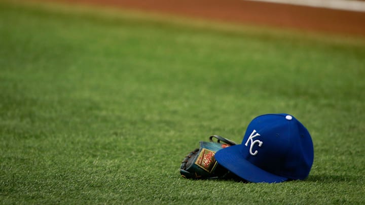 Aug 28, 2015; St. Petersburg, FL, USA; Kansas City Royals hat and glove lays on the field prior to the game against the Tampa Bay Rays at Tropicana Field. Mandatory Credit: Kim Klement-Imagn Images