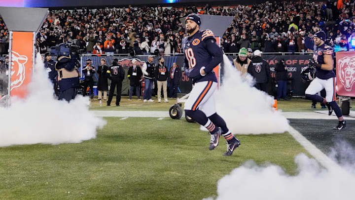 Dec 20, 2025; Chicago, Illinois, USA; Chicago Bears quarterback Caleb Williams (18) runs onto the field during player introductions before the game against the Green Bay Packers at Soldier Field. Mandatory Credit: David Banks-Imagn Images