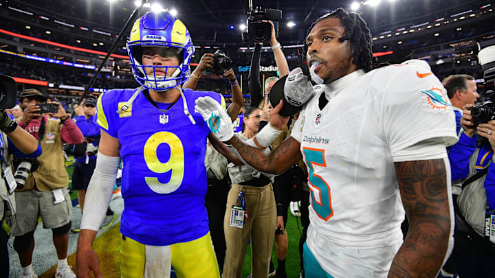 Nov 11, 2024; Inglewood, California, USA; Los Angeles Rams quarterback Matthew Stafford (9) meets with Miami Dolphins cornerback Jalen Ramsey (5) following the game at SoFi Stadium. Mandatory Credit: Gary A. Vasquez-Imagn Images