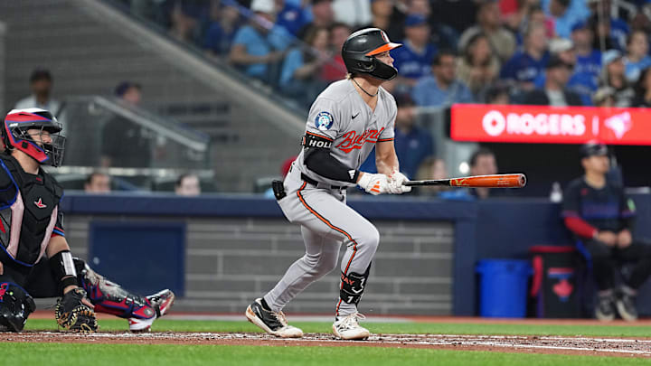 Sep 12, 2025; Toronto, Ontario, CAN; Baltimore Orioles second baseman Jackson Holliday (7) hits an RBI single against the Toronto Blue Jays during the third inning at Rogers Centre. 