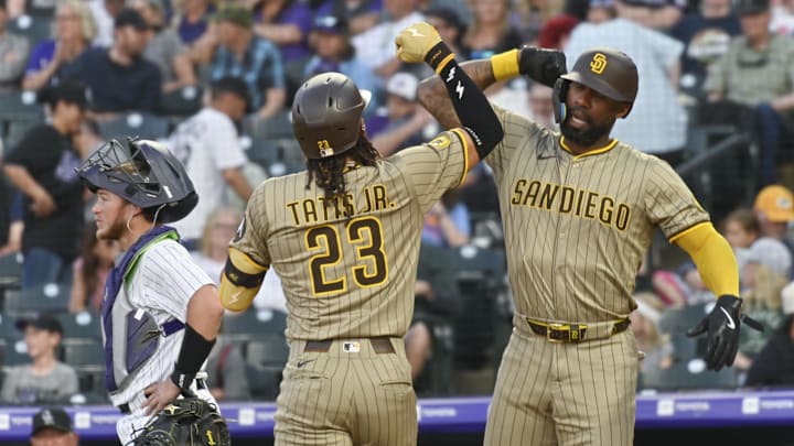 May 10, 2025; Denver, Colorado, USA;  San Diego Padres outfielder Fernando Tatis Jr. (23) is congratulated by San Diego Padres outfielder Jason Heyward (22) after his home run in the fifth inning against the Colorado Rockies at Coors Field. Mandatory Credit: John Leyba-Imagn Images