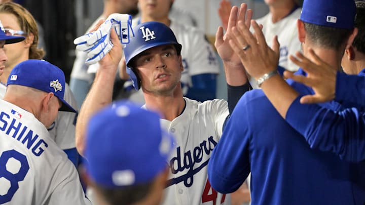 Oct 1, 2025; Los Angeles, California, USA; Los Angeles Dodgers catcher Ben Rortvedt (47) celebrates with teammates in the dugout after scoring a run against the Cincinnati Reds in the third inning during game two of the Wildcard round for the 2025 MLB playoffs at Dodger Stadium. Mandatory Credit: Jayne Kamin-Oncea-Imagn Images