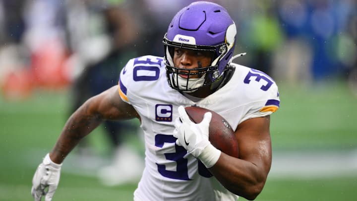 Dec 22, 2024; Seattle, Washington, USA; Minnesota Vikings fullback C.J. Ham (30) carries the ball against the Seattle Seahawks during the first half at Lumen Field. Dec 22, 2024; Seattle, Washington, USA; Minnesota Vikings fullback C.J. Ham (30) carries the ball against the Seattle Seahawks during the first half at Lumen Field.