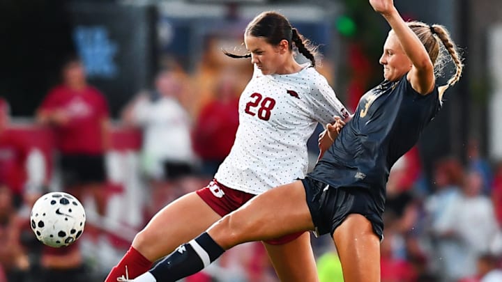 Arkansas sophomore Kyndal Ewertz battles for possession with a Notre Dame defender during Sunday's match at Razorback Field.