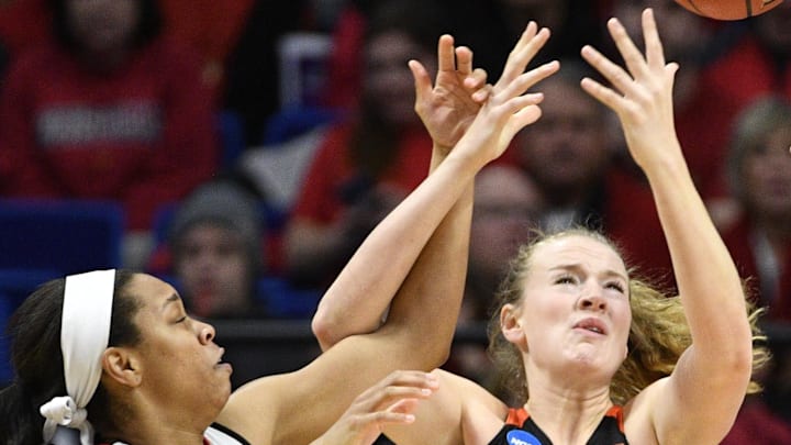 Mar 25, 2018; Lexington, KY, USA; Louisville Cardinals guard Asia Durr (25) battles Oregon State Beavers center Marie Gulich (21) for a rebound during the first half in the championship game of the Lexington regional of the women's basketball 2018 NCAA Tournament at Rupp Arena. Mandatory Credit: Jamie Rhodes-Imagn Images Mar 25, 2018; Lexington, KY, USA; Louisville Cardinals guard Asia Durr (25) battles Oregon State Beavers center Marie Gulich (21) for a rebound during the first half in the championship game of the Lexington regional of the women's basketball 2018 NCAA Tournament at Rupp Arena. Mandatory Credit: Jamie Rhodes-Imagn Images